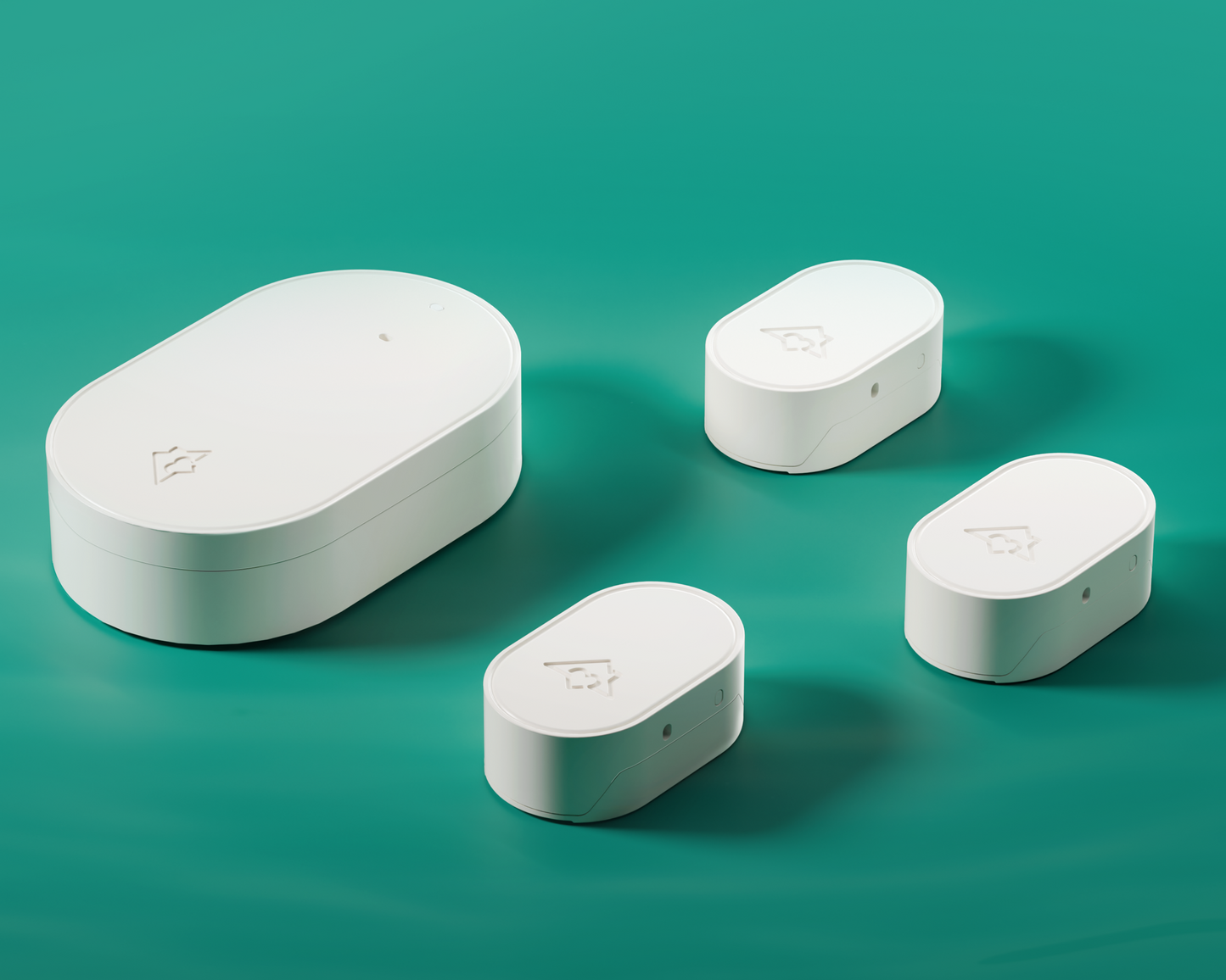 Four white electronic devices on a teal background